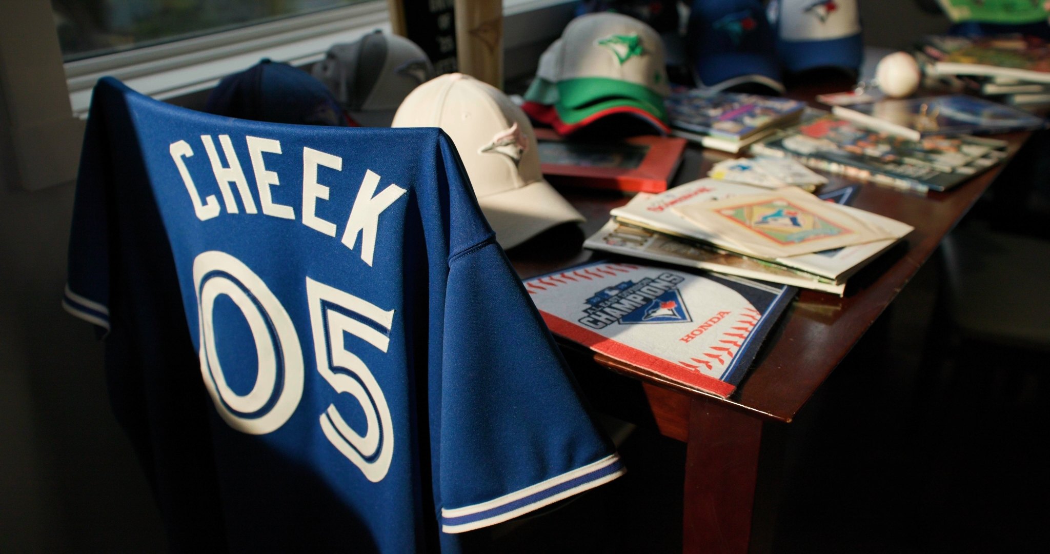 Cheek 05 Blue Jays jersey and cap collection detail — ad frame