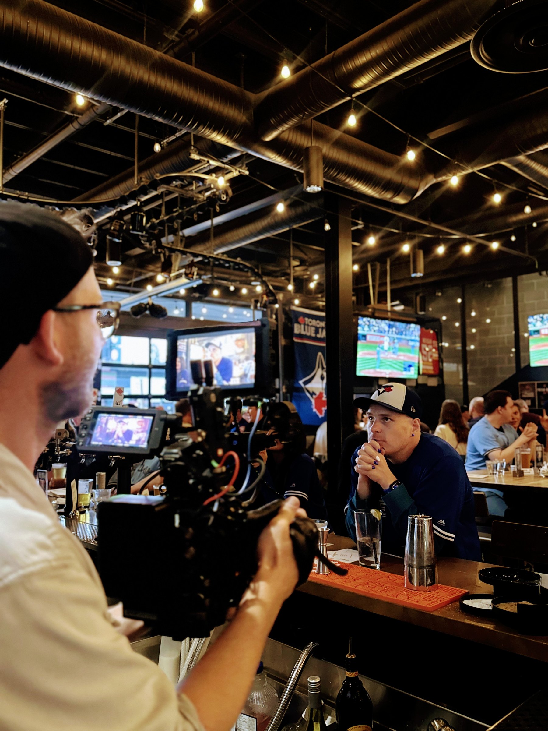 BTS: Dave Copithorne filming the praying-hands shot at the bar during the Blue Jays campaign