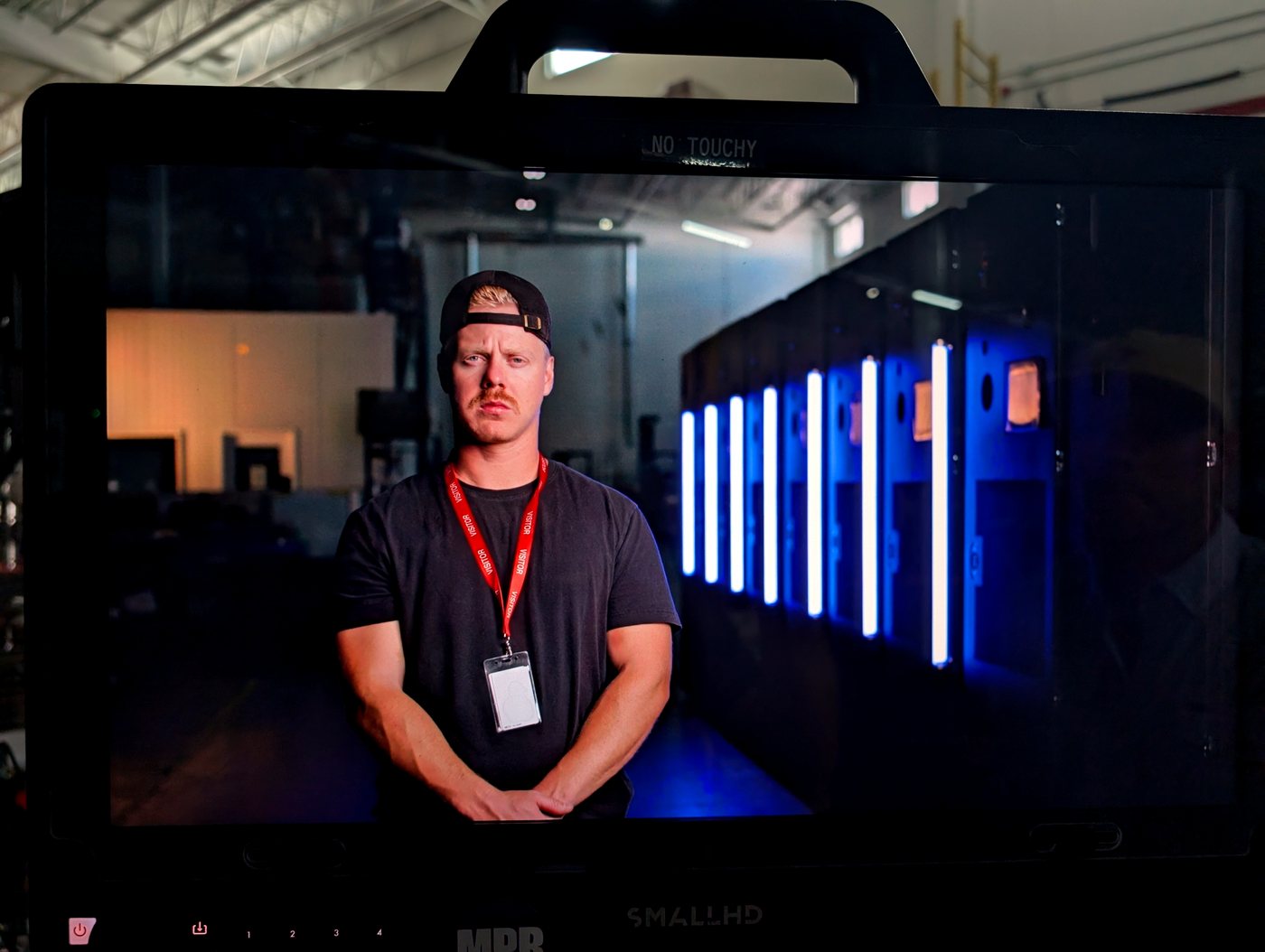Client monitor on set showing the framed CEO interview during the CoolIT shoot, Calgary