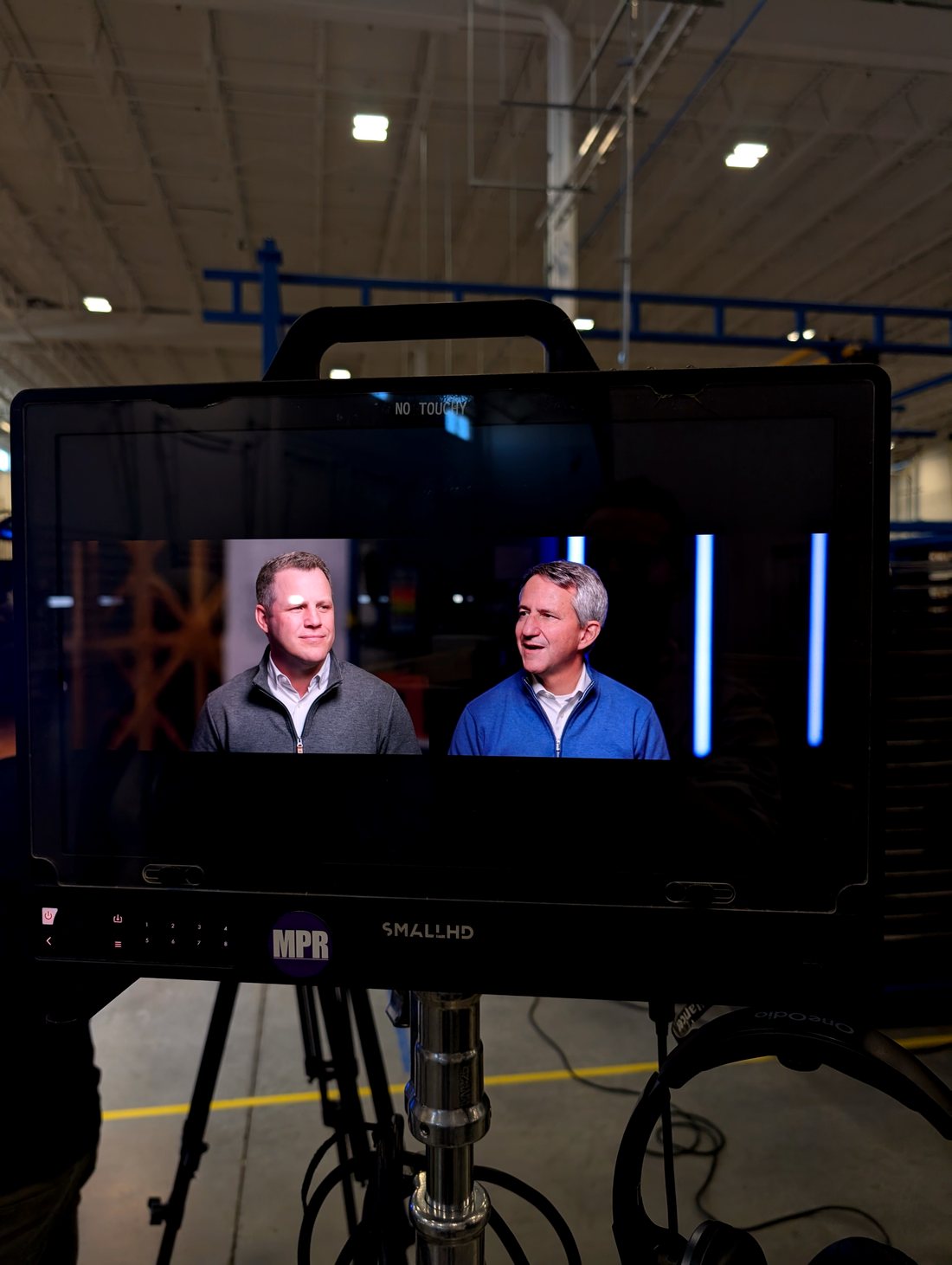 On-set monitor showing the two CEOs framed for their interview, CoolIT Calgary