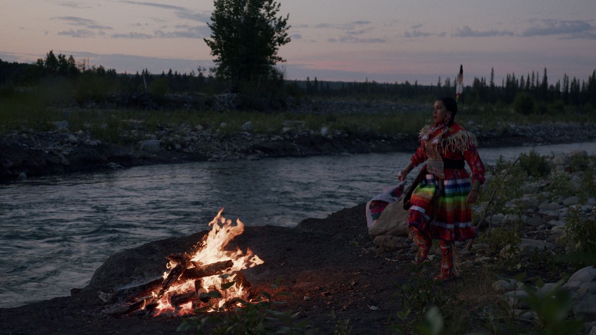 Tsuut'ina Nation dancer by campfire