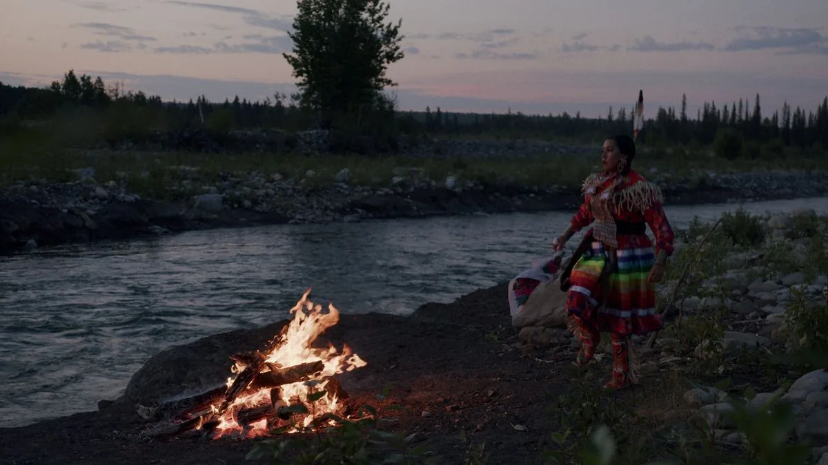 Tsuut'ina Nation dancer by campfire