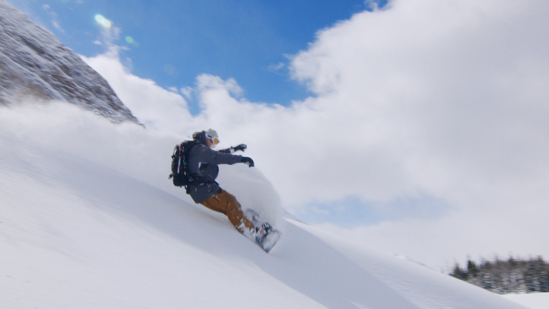 Snowboarder in powder — Alberta backcountry