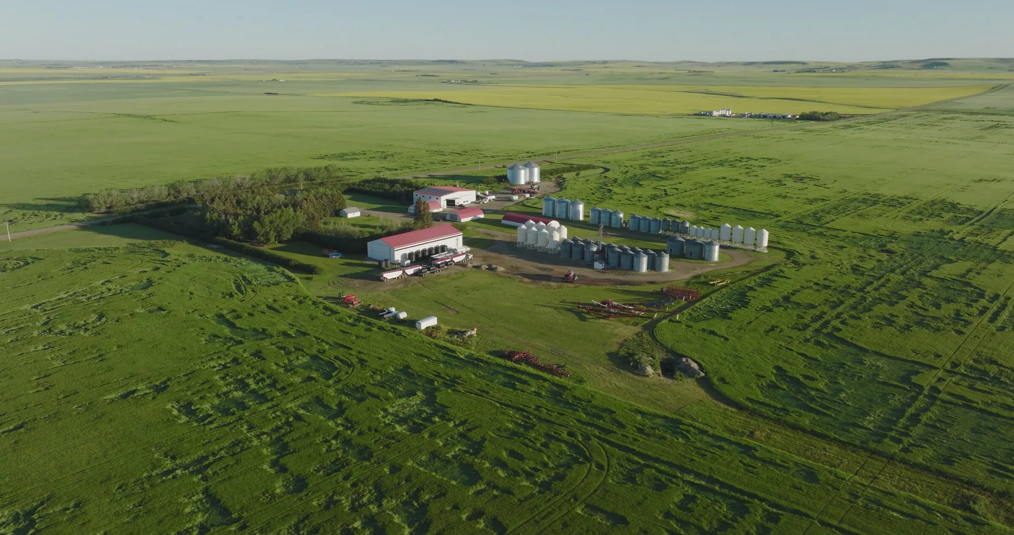 Aerial drone photo of an Alberta farm surrounded by green fields, shot for Nutrien