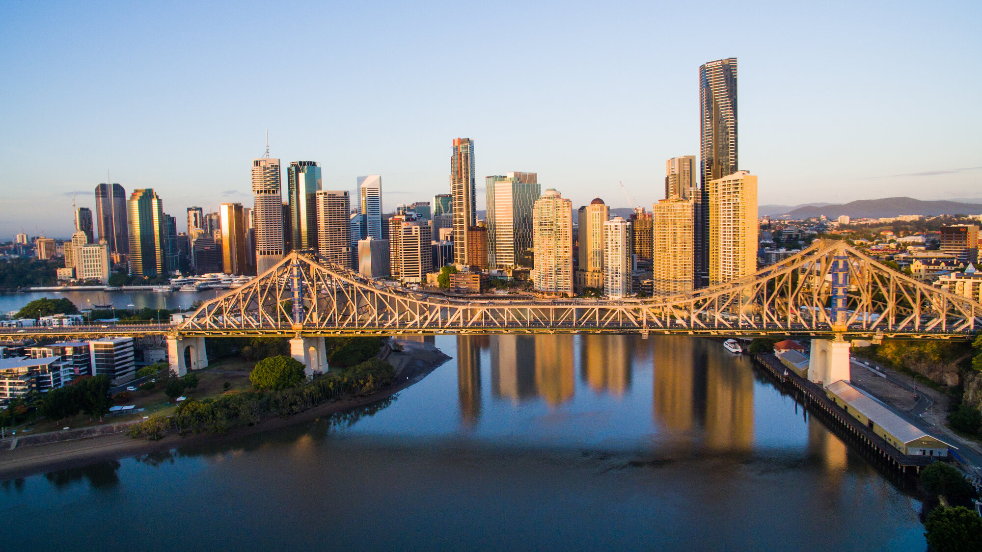 Brisbane skyline and Story Bridge at sunrise from the air