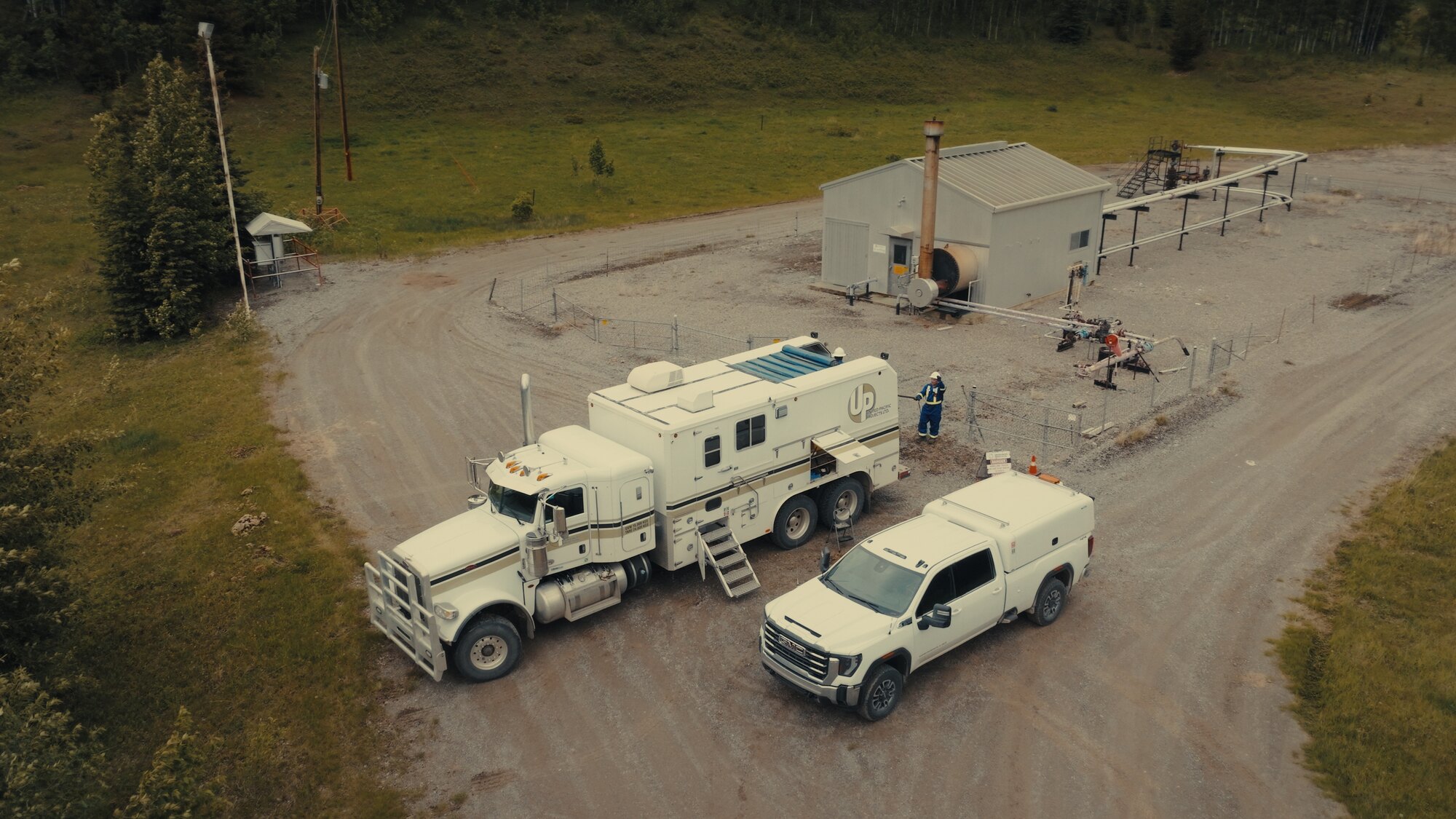 Oil and gas wellsite service units from above, aerial drone documentation