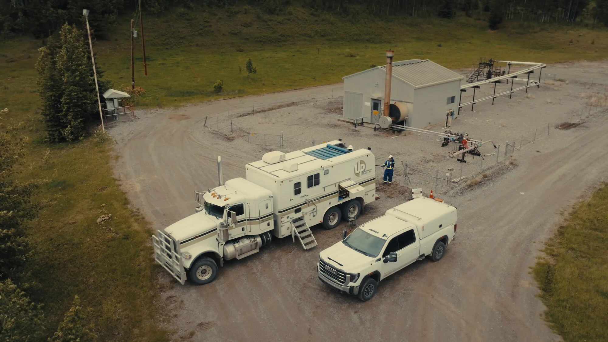 Oil and gas wellsite service units from above, aerial drone documentation
