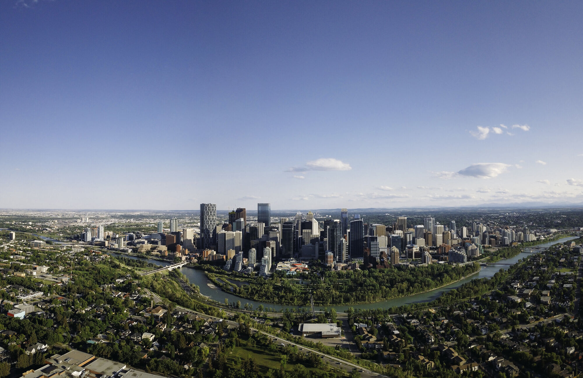 Aerial drone photo of the downtown Calgary skyline and Bow River — drone services Calgary by DCFOTOFILM