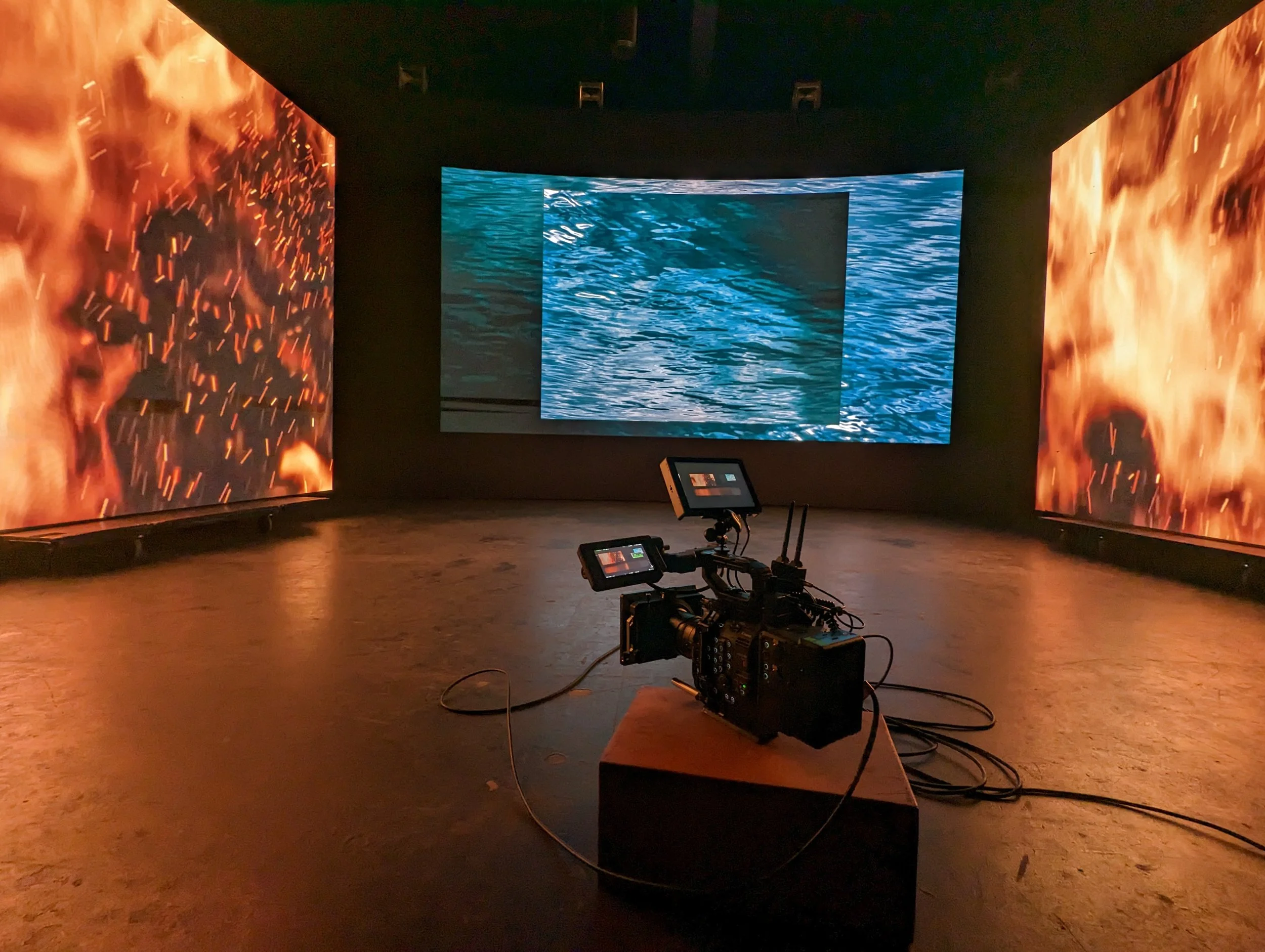 Cinema camera in LED volume fire and water stage