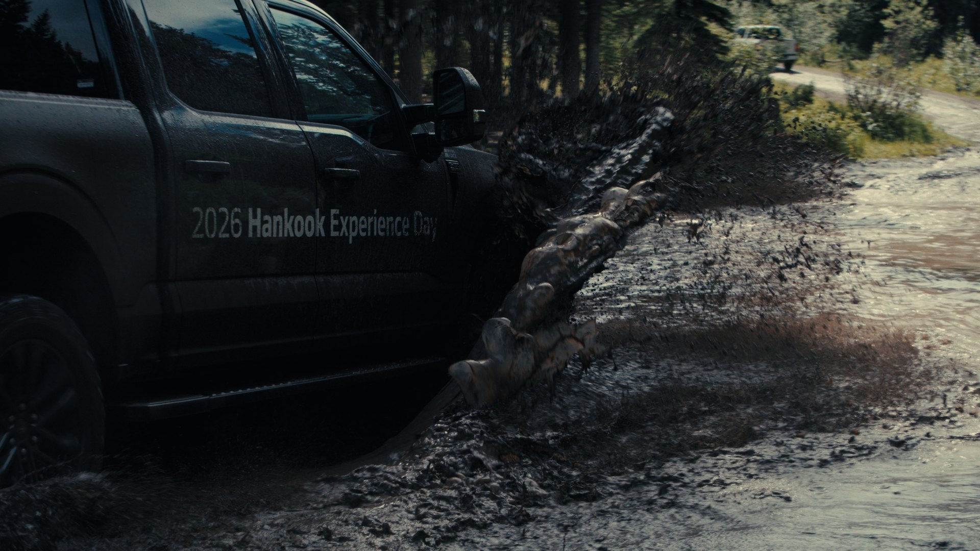 Truck through a deep mud puddle — Hankook MT2 frame