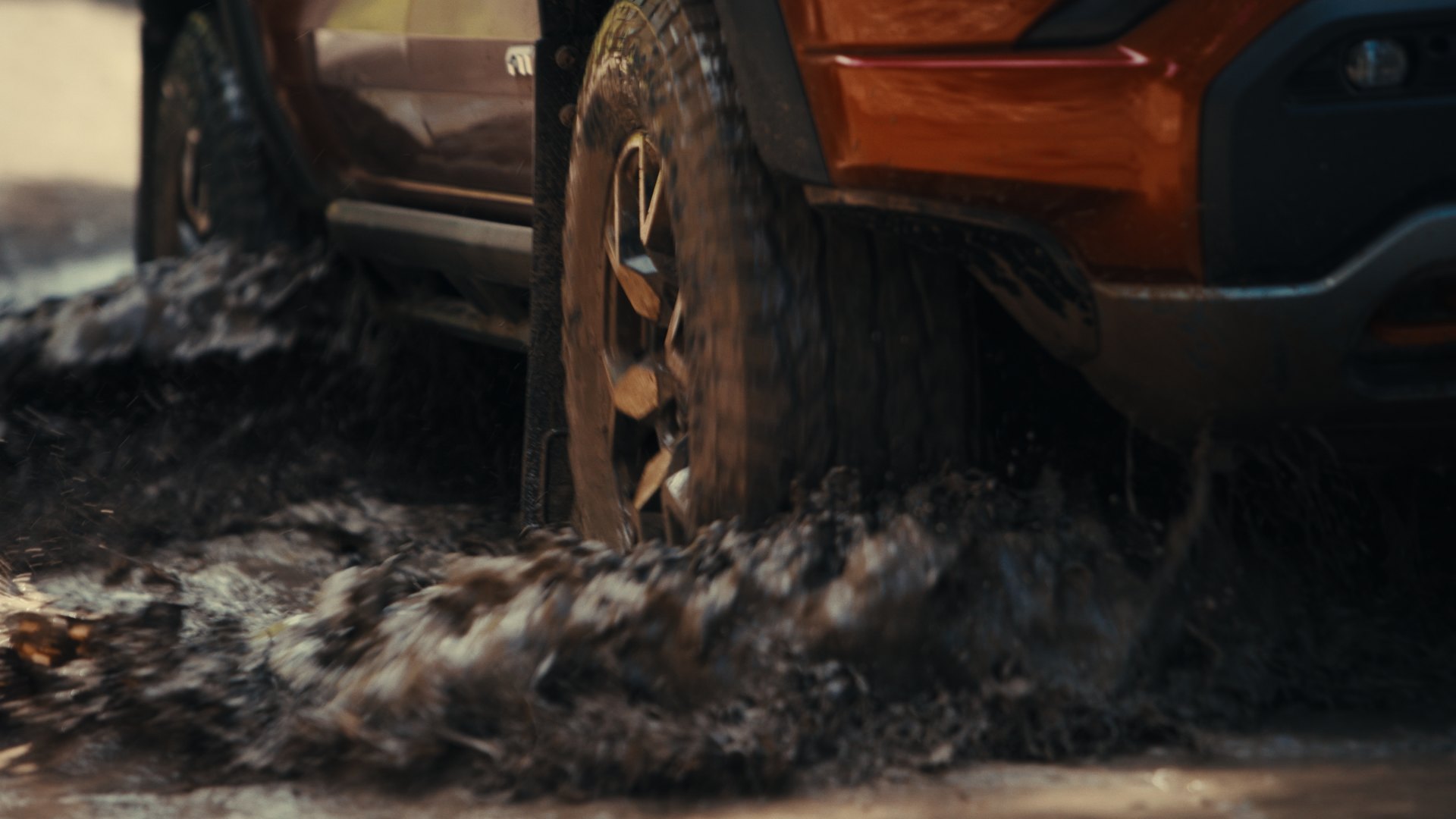 Close-up of an off-road wheel and Hankook MT2 tire in mud
