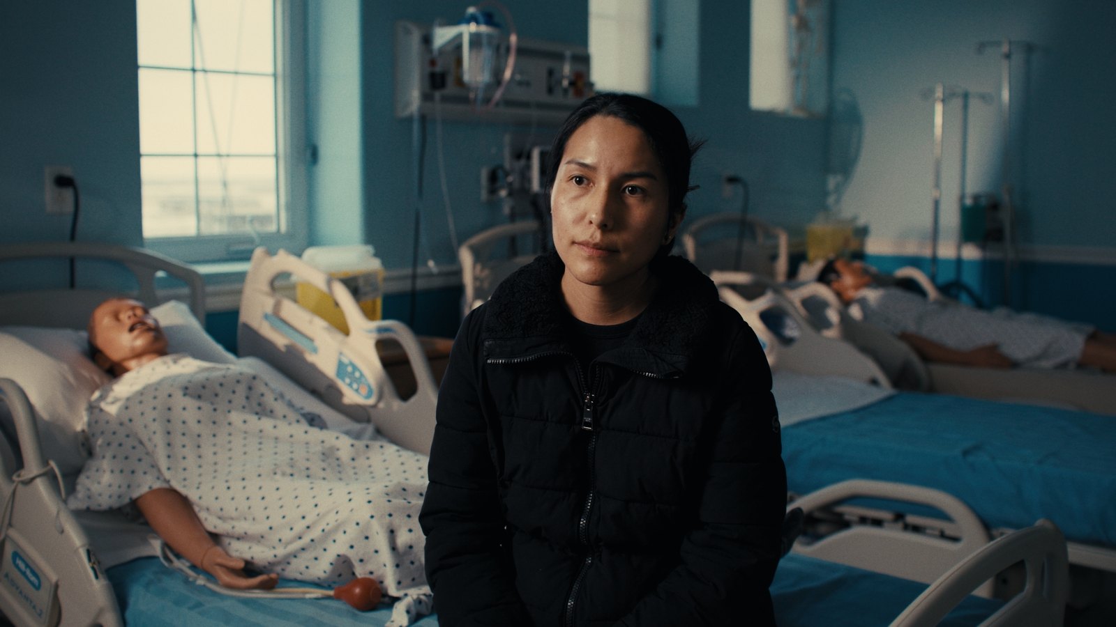 Documentary interview frame — Jazz, wide hospital ward shot