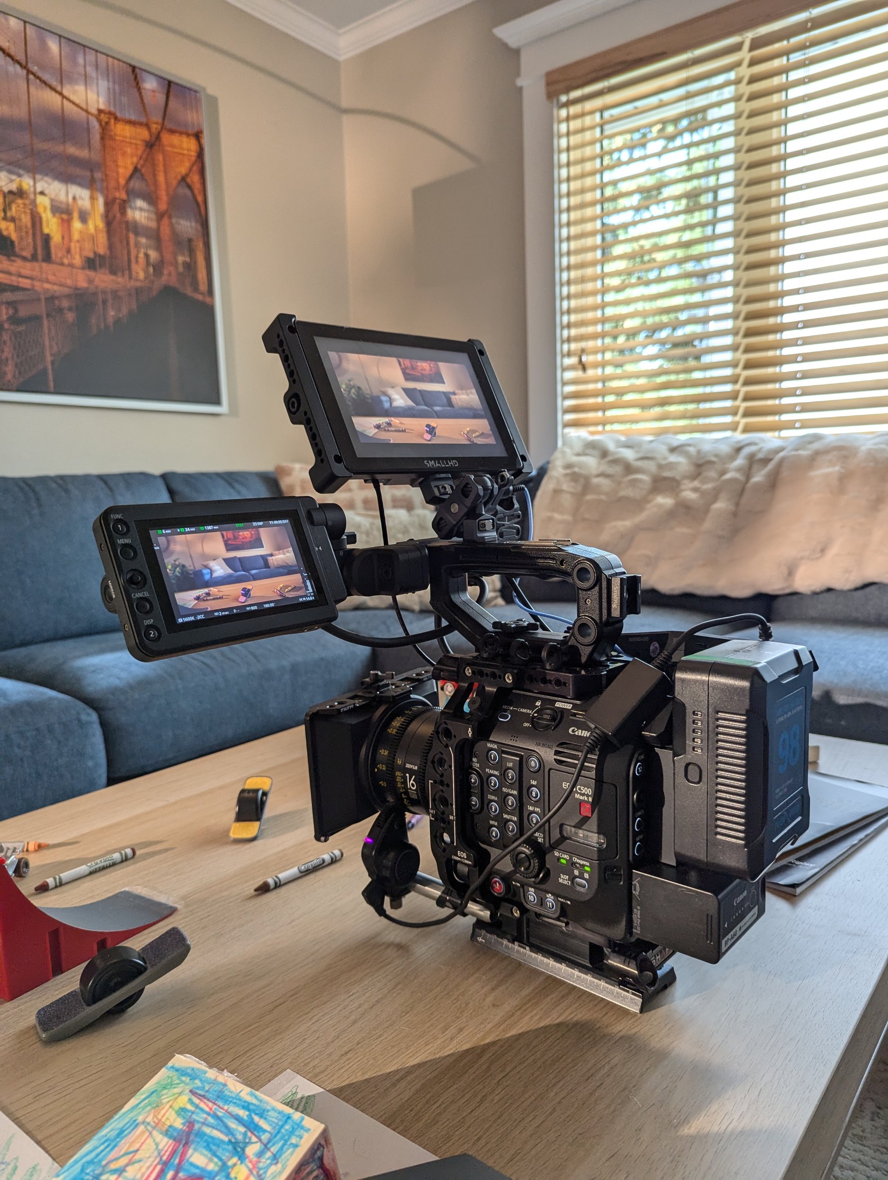 Canon EOS C500 Mark II camera rig on coffee table with SmallHD monitors — Onewheel commercial production, Dave Copithorne's living room, Calgary 2024