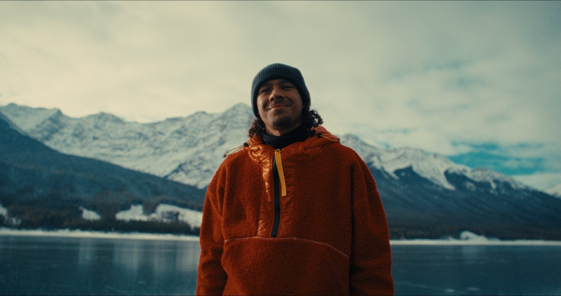 Figure skater Elladj Baldé on a frozen lake in Kananaskis — frame from Wild Ice, shot by DCFOTOFILM