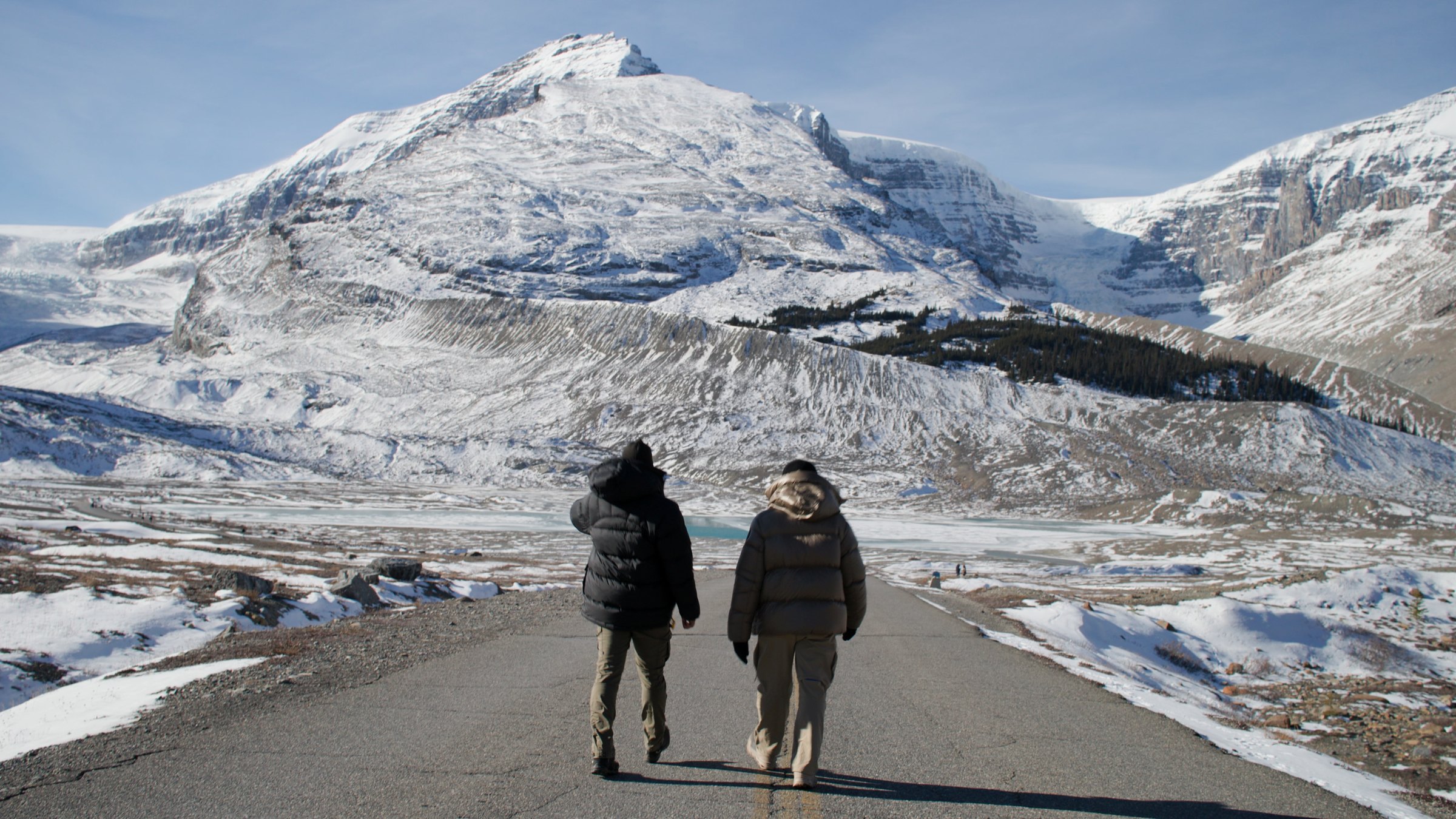 Two figures on frozen lake — Wild Ice