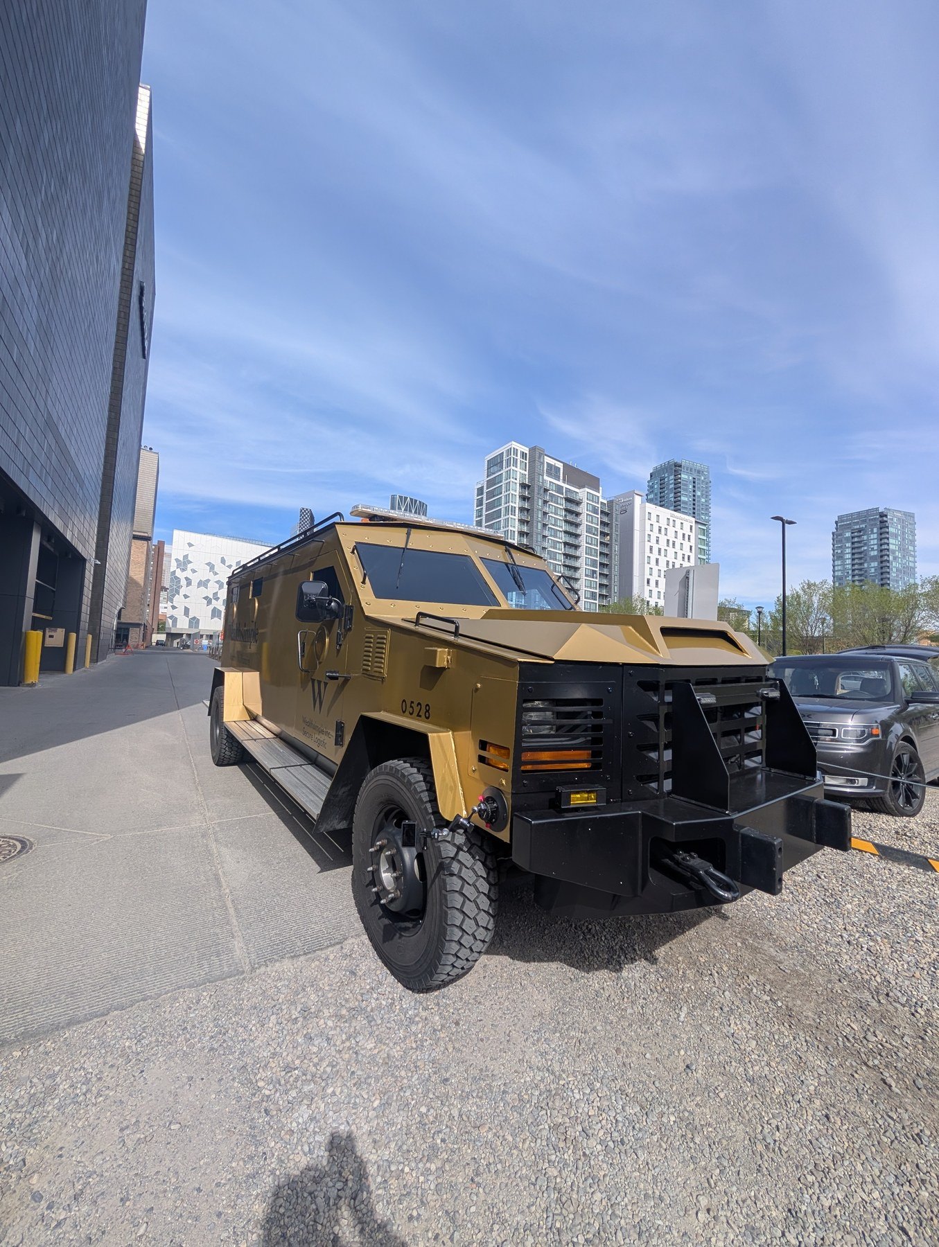 Wealthsimple Monthly Millionaire armored truck on Calgary streets — commercial shoot BTS